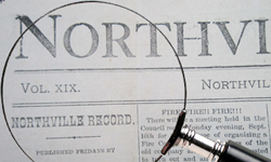 Picture of Northville Record with a Magnifying Glass
